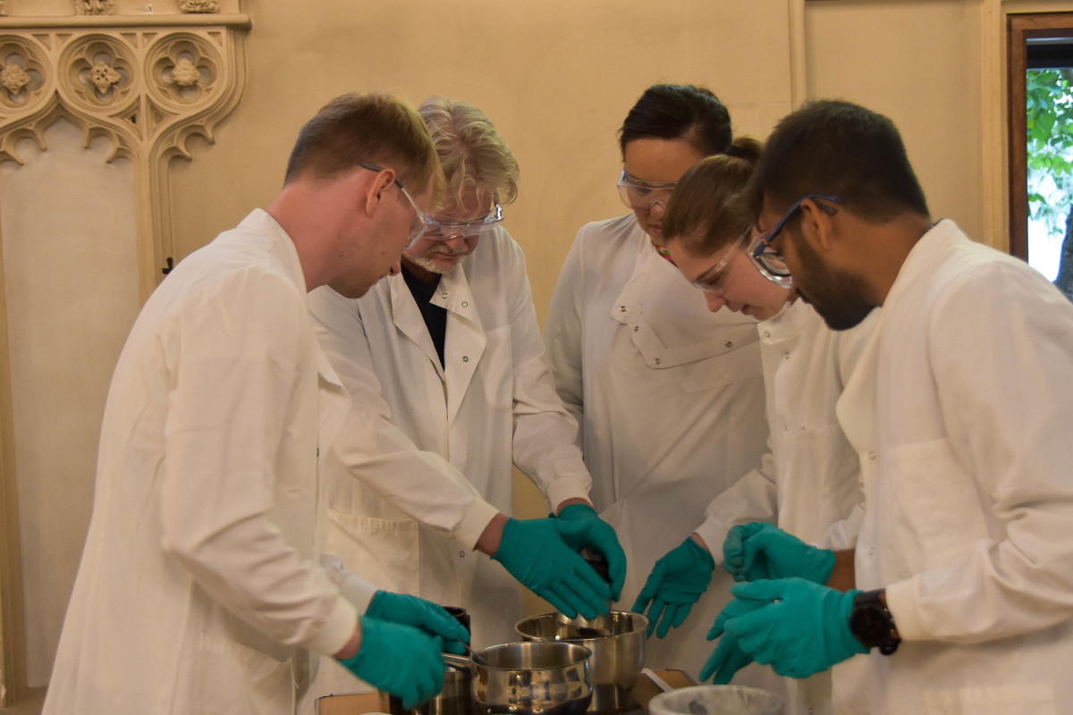 Professor John Carr and students in the chapel of Corpus Christi College, Cambridge with Dr Betty Chung back left, front right is Robbie Waddell, a PhD student in the MRC Mitochondrial Unit. Next to Dr Chung (middle) is Jennifer Palmer a PhD student in the Cambridge Institute for Medical Research and Satish Viswanathan (foreground), a PhD student in Plant Sciences.